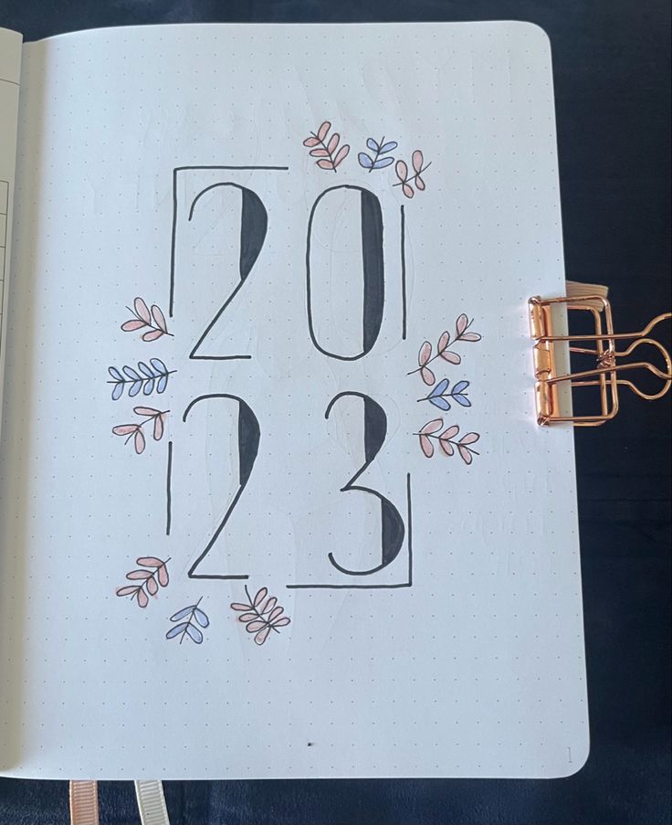 an open notebook with the number twenty two on it