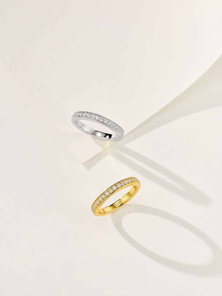 This minimalist stacking ring is crafted from 925 sterling silver with a luxurious gold-plated finish. Featuring a delicate row of sparkling diamonds, it offers a refined yet captivating look. Perfect for stacking or wearing alone, this ring adds a touch of elegance to any outfit, making it an ideal choice for everyday wear. Metal: 18K Recycled Gold Plated Vermeil on Recycled Sterling Silver/Recycled Sterling Silver Gemstone: Cubic Zirconia Ring Sizes Available: 5, 6, 7, 8(US) Pearls Ring, Sliver Earrings, Pearl Rings Vintage, Cubic Zirconia Rings, Outfit Making, Tiger Eye Stone, Enamel Earrings, Ring Sizes, Recycled Gold