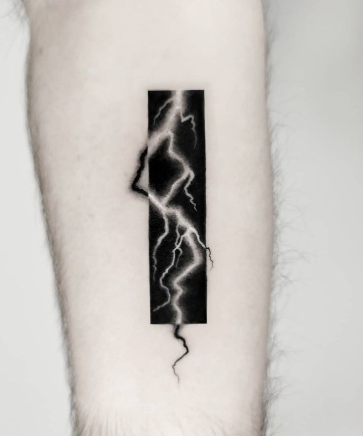 a man's arm with a lightning tattoo on the left side of his body