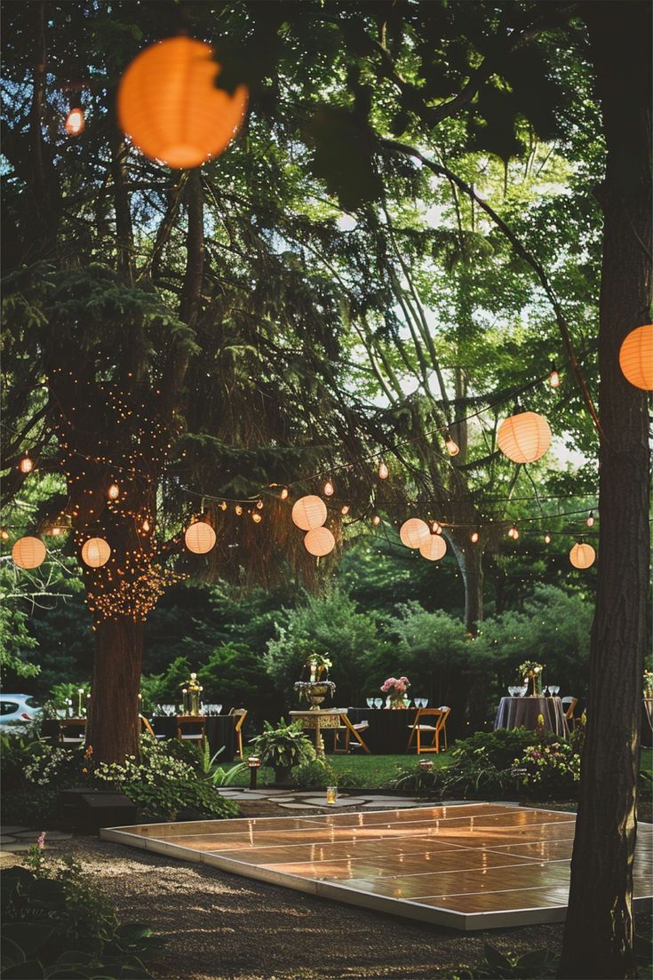 Delightful DIY Outdoor Wedding Dance Floor Outdoor Wedding Dance Floor, Diy Wedding Lanterns, Garden Wedding Themes, Fairy Lights And Flowers, Wedding Ideas Garden, Outdoor Dance Floors, Wedding Dance Floor, Dance Floor Lighting, Tree Lanterns