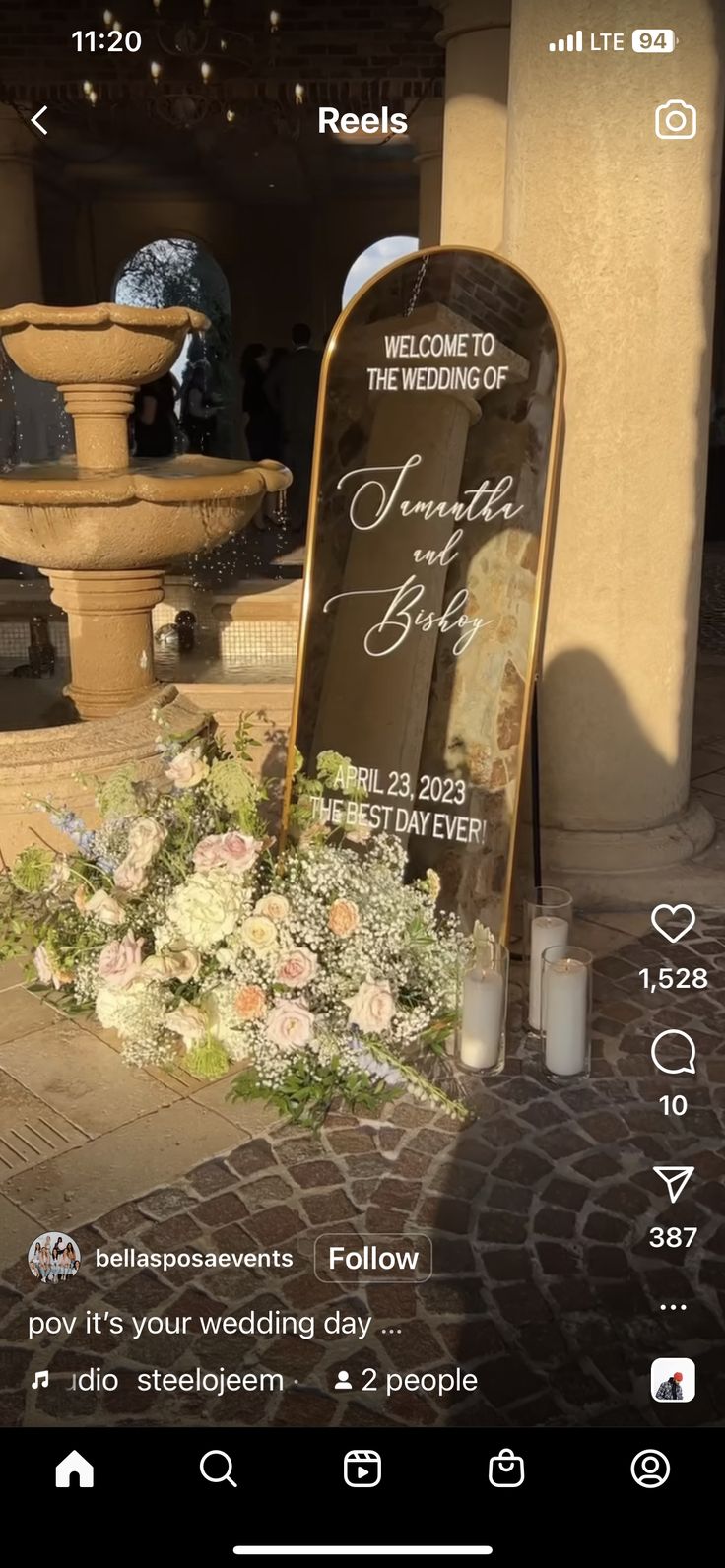 an image of a memorial with flowers and candles in front of it on the phone screen