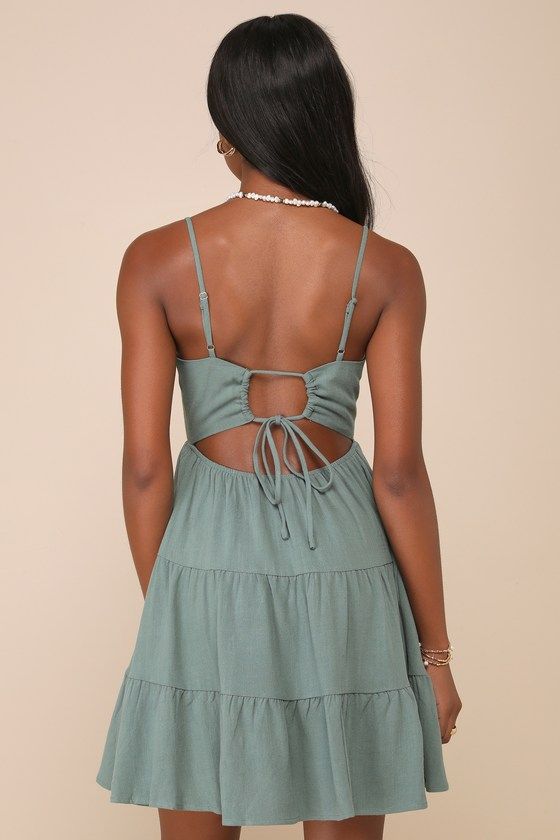 The Lulus Make a Day of It Green Cutout Tiered Mini Dress will have you wantin' to spend the day out on the town! Linen-blend woven fabric shapes this dress that has adjustable spaghetti straps, a straight neckline, and a princess-seamed bodice. A high waist tops a tiered mini skirt. Large cutout at back with a cinching tie that creates a smaller cutout. Fit: This garment fits true to size. Length: Mid-thigh. Size medium measures 27.5" from adjustable straps to hem. Bust: Great for any cup size. Backless Dresses With Straps For Day Out, Summer Brunch Dress With Strappy Back, Spring Strappy Dress With Tie Straps, Strappy Dress With Tie Straps For Spring, Spring Dresses With Knotted Straps And Straight Neckline, Summer Mini Dress With Delicate Straps For Brunch, Strappy Back Brunch Dress With Tie Straps, Spaghetti Strap Sundress With Tie Back For Casual Wear, Summer Mini Dress With Delicate Straps For Day Out