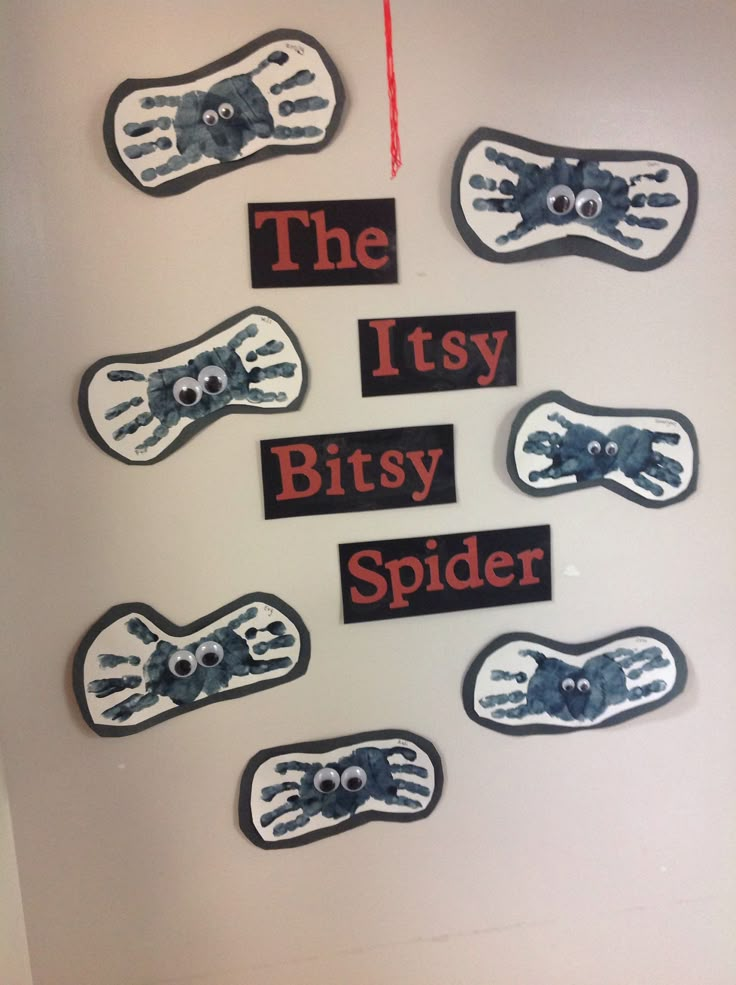 there are many handprints on the wall that say, the itty bitsy spider