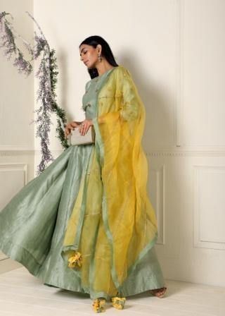 Featuring a sage green anarkali in raw silk base with hand embroidery on the yoke. It is paired with a contrast yellow dupatta in organza base.Care:Dry Clean OnlyComposition:Raw Silk Sage Green Anarkali Dress, Designer Green Cotton Silk Anarkali Set, Green Anarkali Sharara In Cotton Silk, Festive Green Slub Silk Lehenga, Green Anarkali Style Cotton Silk Sharara, Green Slub Silk Lehenga With Dupatta, Green Slub Silk Designer Dress, Green Anarkali Set In Tissue Silk With Traditional Drape, Green Anarkali Set With Traditional Drape In Tissue Silk