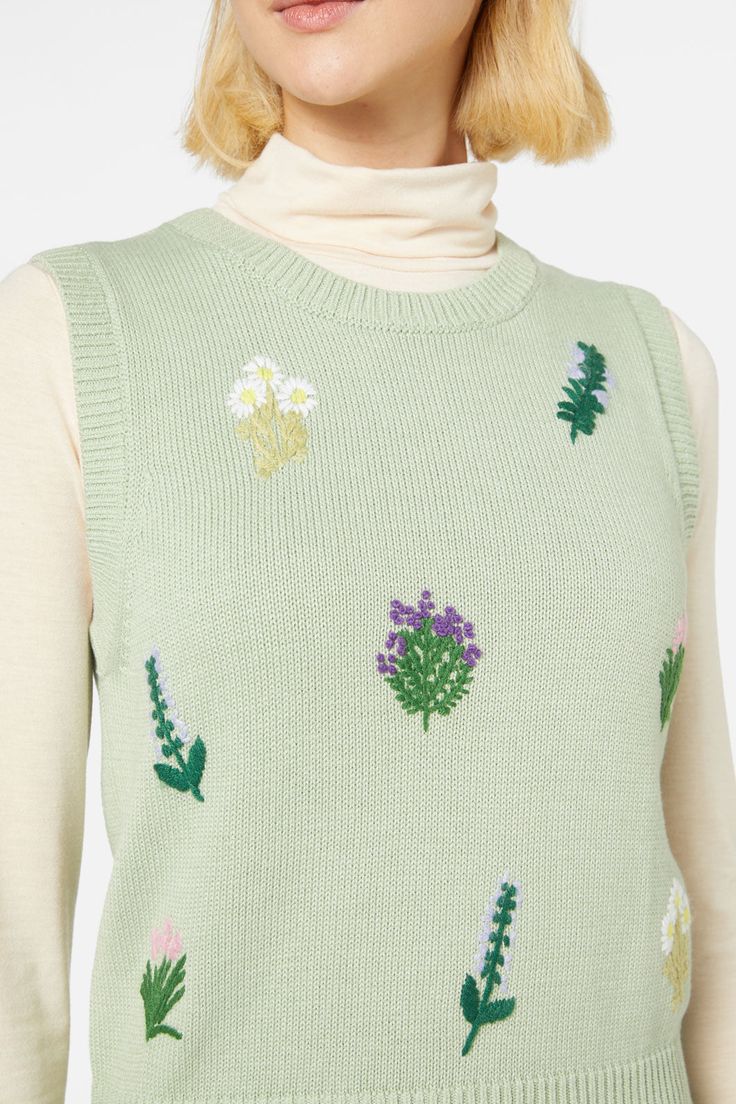 Herb flower embroidered vest- featuring hand embroidered herbs scattered across the body- round neckline- sleeveless style- ribbed neckline, hem adn armholes- plain jersey knit style- crafted from an acrylic cotton blend yarn- available in green Product Code: PGFX435 Spring Cotton Crew Neck Tank Top, Spring Crew Neck Cotton Tank Top, Green Cotton Crew Neck Sweater Vest, Green Cotton Crew Neck Vest, Spring Green Crew Neck Tank Top, Casual Floral Embroidered Vest For Fall, Spring Green Knit Vest, Casual Embroidered Tank Top For Spring, Green Crew Neck Tank Top For Fall