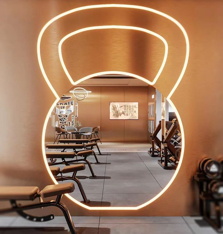 a mirror reflecting the inside of a room with chairs and tables in front of it