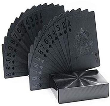 four black playing cards sitting next to each other