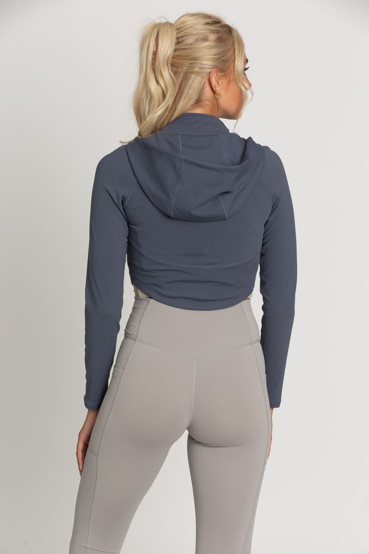 The perfect throw-on-and-go jacket is our Storm Athletic Hoodie Jacket. This piece features a classic hoodie style with thumb-hole finished sleeves. The material is a soft, stretch fabric that controls temperature and provides a cool, sporty look. Athletic Hoodie, Hoodie Style, Tennis Skirts, Athletic Top, Yoga Tops, Sporty Look, Thumb Holes, Athletic Shorts, Hoodie Jacket