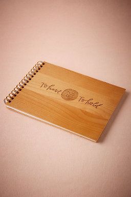 a wooden notebook with the words thank you written on it