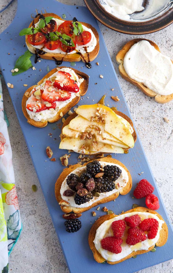 an assortment of food is displayed on a blue platter