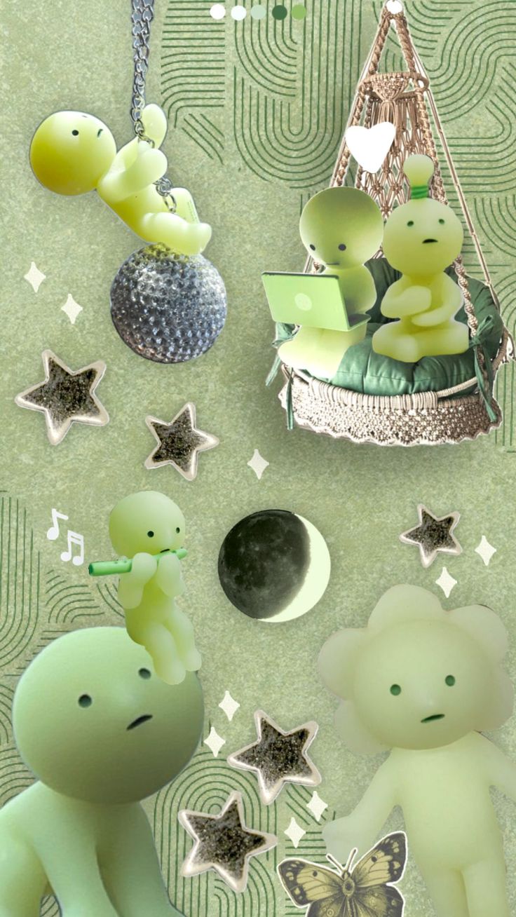 two green teddy bears sitting next to each other in front of stars and moon shapes