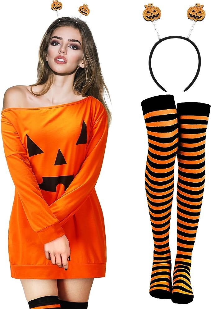 a woman in an orange dress and black striped stockings with pumpkins on her head