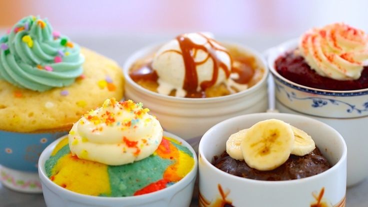 four small cups filled with different types of desserts and toppings on top of each other