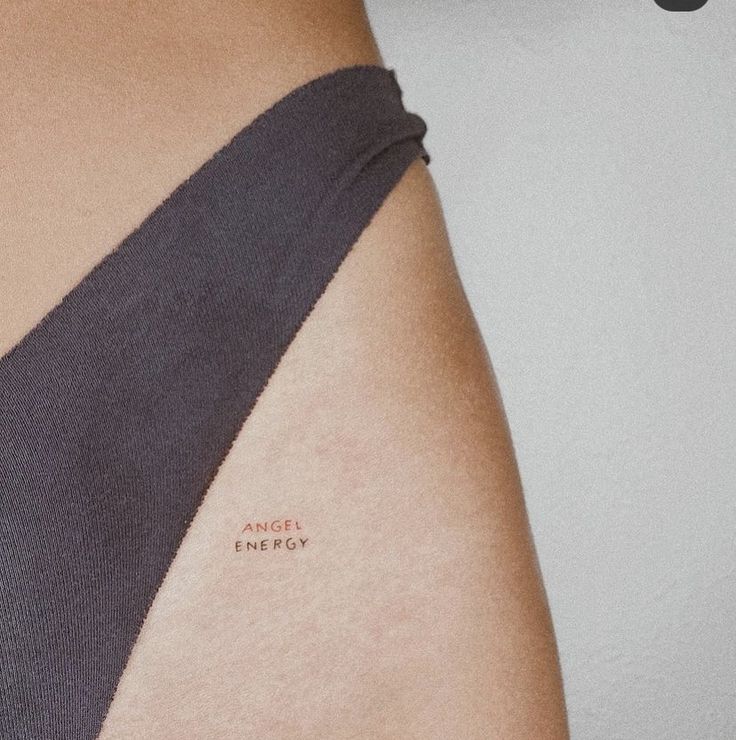 a woman's arm with the word love written on it