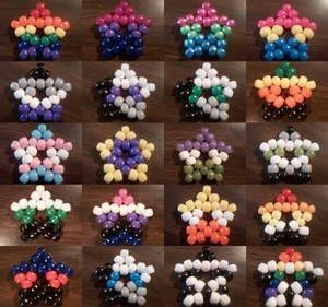 many different colored candies arranged on a table