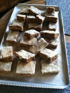 there are many small pieces of cake on the trays that have been cut into squares