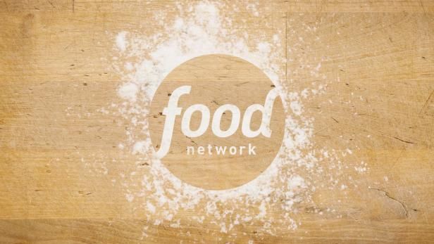 the food network logo is shown on a piece of wood that has been stained white