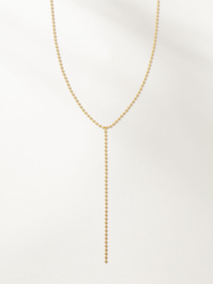 Ball Chain Lariat Necklace | Gold | Product Image | Uncommon James Minimalist Long Lariat Necklace With Adjustable Chain, Adjustable Y-shape Lariat Necklace, Dainty Adjustable Lariat Body Chain, Dainty Lariat Body Chain With Adjustable Chain, Dainty Lariat Gold Chain Necklace, Dainty Lariat Clavicle Body Chain, Minimalist Delicate Lariat Body Chain, Dainty Clavicle Lariat Body Chain, Dainty Delicate Chain Long Drop Necklace