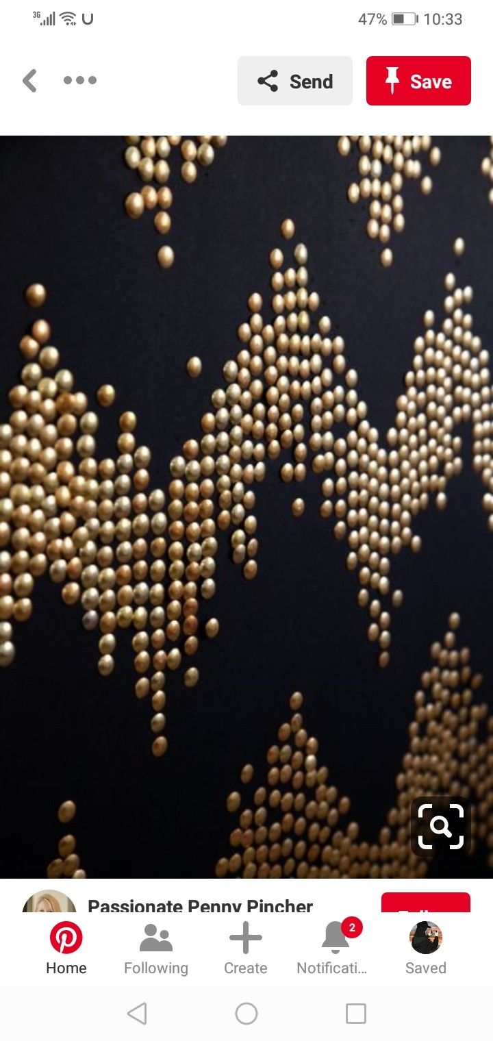 an image of some gold beads on a black background with red and white text that reads,