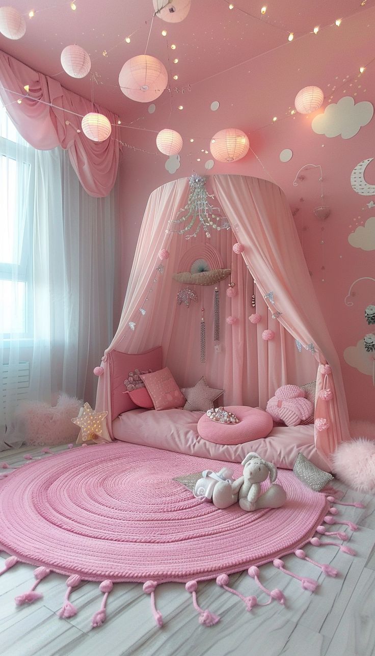 a bedroom with pink walls and ceiling decorations