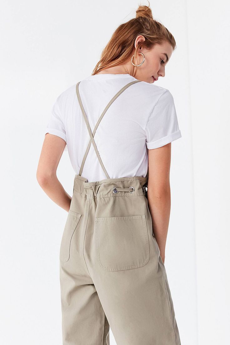 Details Workwear-inspired apron look overall that majorly upgrades your utilitarian game. Made from a lightweight linen-blend fabrication in a sleeveless, relaxed-fit silhouette that features a tie at the waist + silver grommet detailing. Features an open back with cross-strap detailing. Finished with a straight-leg pant bottom, side-entry pockets + pockets at the back. Content + Care- Linen, rayon- Machine wash- Imported color : Taupe(tan-beige) Size + Fit- Model is 5'10" and wearing size Small Waist Apron, Cross Straps, Overall Shorts, Straight Leg Pants, Linen Blend, Open Back, Apron, Fitness Models, Work Wear