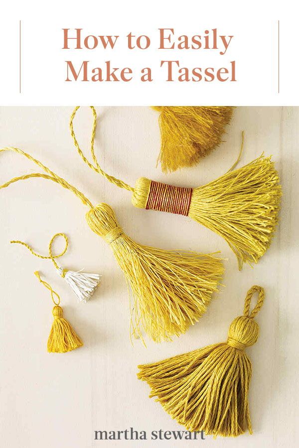 four tassels are arranged on a white surface, one is yellow and the other is red