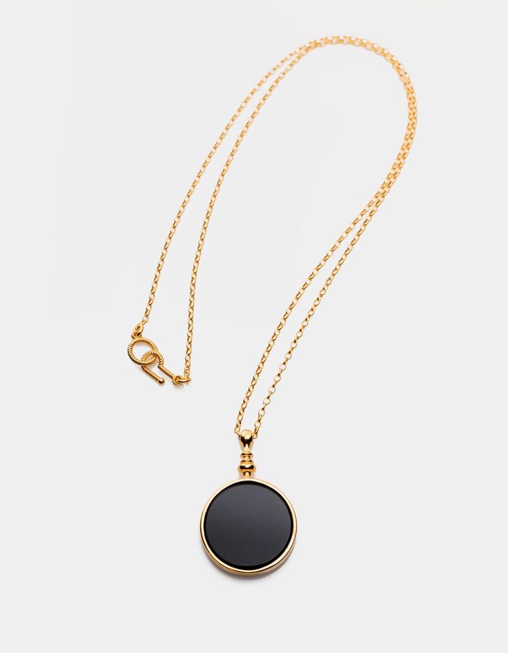 The black mirror is a symbol of our times. We live in a world of black, shiny surfaces, behind which there is a parallel, yet unrecognized reality.Necklace with a natural, black stone, onyx, made of 925 silver optional plated with 24-carat gold. It has a special hook and eye clasp. Diameter: 27 mm, height: 42 mm, thickness: 4 mm. Chain length: 600 mm.The product is made entirely in Poland. Possible chain length personalization on request. Waiting time up to 20 business days. Write a message what Mirror Necklace, Figaro Necklace, Black Mirror, Black Stone, Gold Plated Silver, Cleaning Jewelry, In A World, Jewelry Branding, Chain Lengths