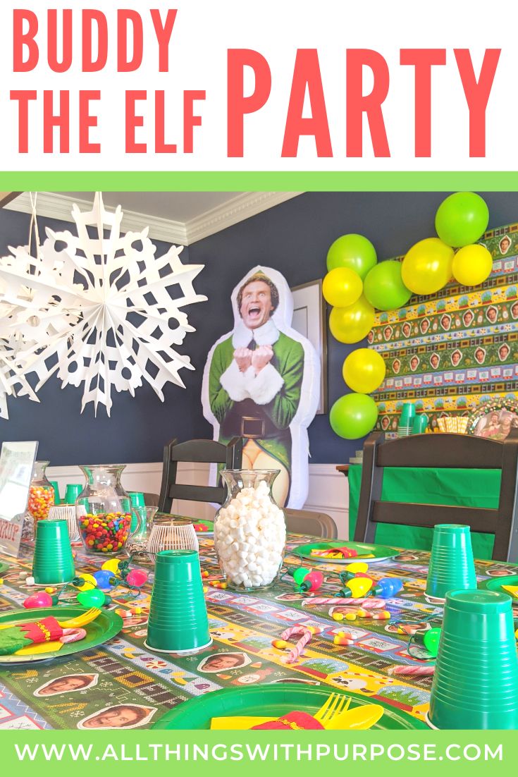 an image of a party with balloons and paper snowflakes on the table for buddy the elf