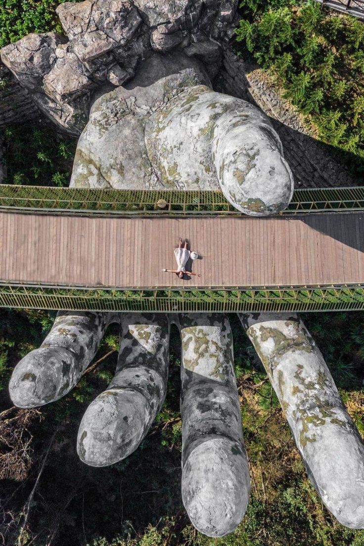 Image of a woman laying on the Golden Bridge in Sunworld Ba Na Hills in Da Nang, Vietnam Golden Hands Bridge Vietnam, Ba Na Hills Vietnam, Golden Bridge Vietnam, Vietnam Jungle, Vietnam Travel Photography, Ba Na Hills, Vietnam Photography, Vietnam Vacation, Natural Wonders Of The World