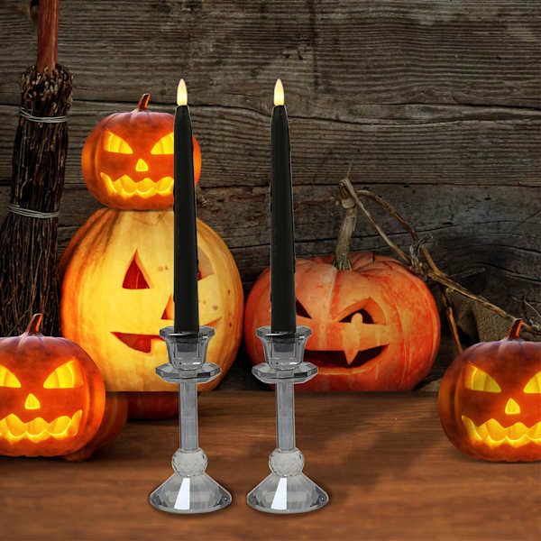 halloween pumpkins and candles on a wooden table