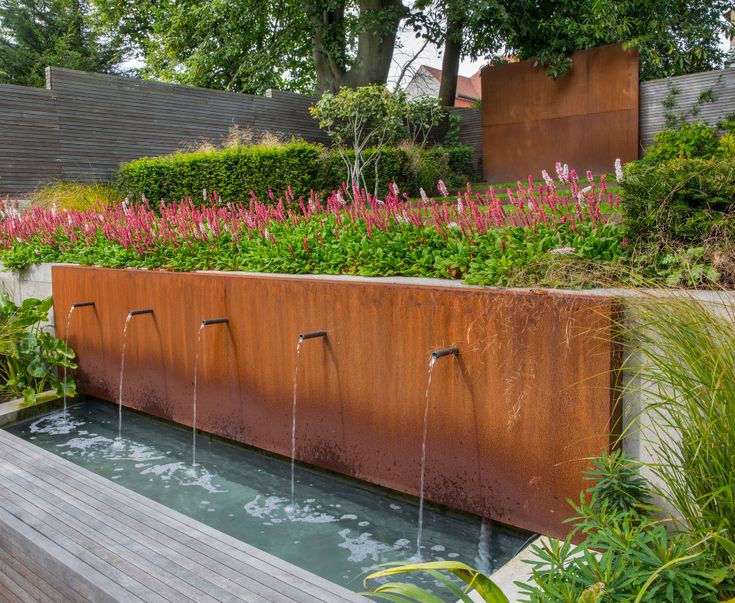 a water feature in the middle of a garden