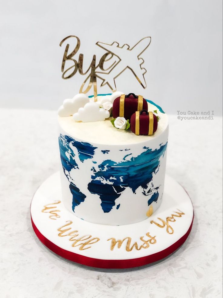 a white and blue cake with an airplane on top