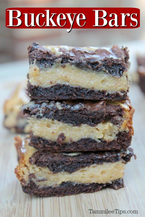 four pieces of cake sitting on top of a wooden table