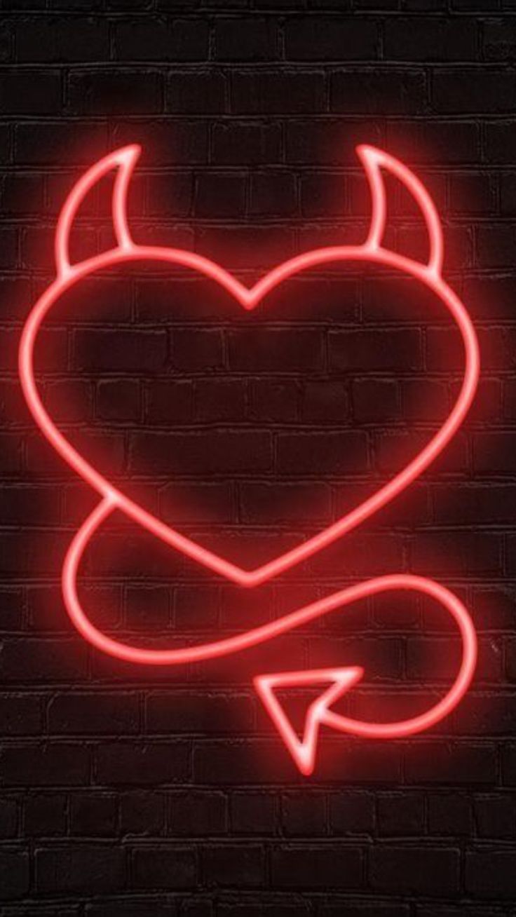 a neon heart with an arrow in the middle