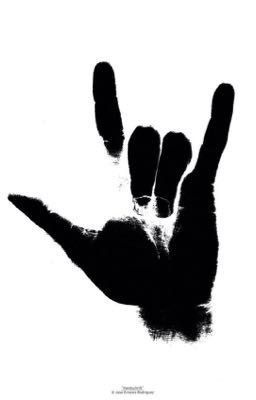 a black and white photo of a person's hand holding up the middle finger