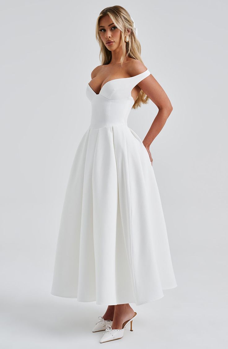 The epitome of elegance, Lanetta features a plunge bardot neckline with elasticated back strap bringing stylish flair. Falling to an effortlessly chic midi length, the design has a full, box pleated skirt and looks amazing paired with pointed heels and soft glam. 



Colour: Ivory.

Premium non-stretch crepe.

Fully lined.

Plunge bardot neckline.

Shaped underbust seam.

Full, box pleated skirt.

Elasticated back strap.

Invisible zipper fastening.

Midi length.

 Size: XS, S, M, L, XL, XXL Evening Midi Dress With Box Pleat, Tea-length Lined Bodice Midi Dress For Wedding, Tea Length Lined Bodice Midi Dress For Wedding, White Voluminous Skirt Evening Dress, White Evening Dress With Voluminous Skirt, Formal Dress With Pleated Back And Sweetheart Neckline, Formal Dress With Sweetheart Neckline And Pleated Back, Cocktail Midi Dress With Box Pleat, A-line Midi Dress With Ruched Bodice For Gala