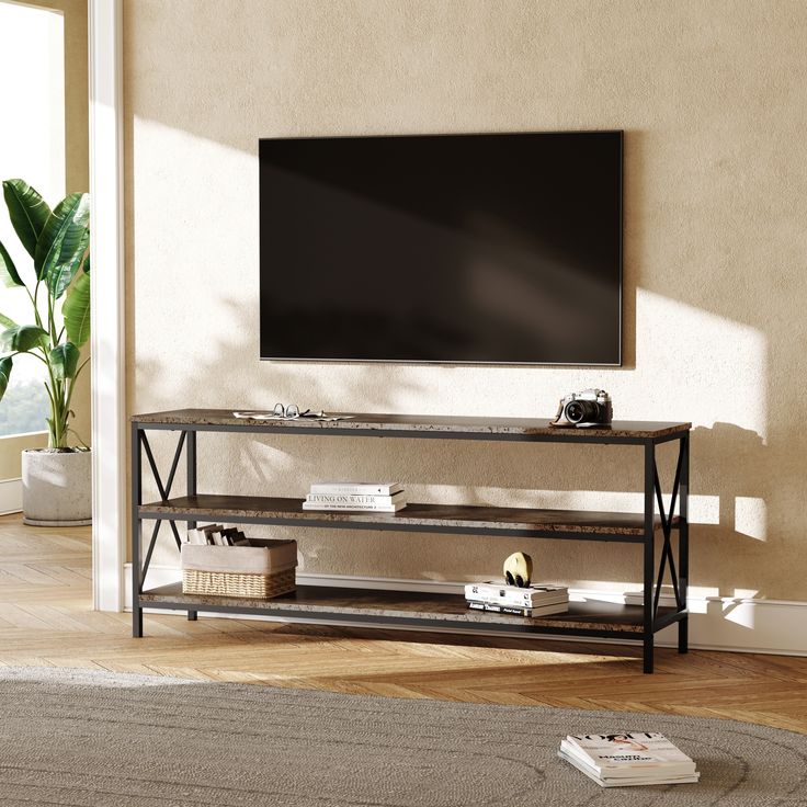 a flat screen tv sitting on top of a wooden shelf in a living room next to a window