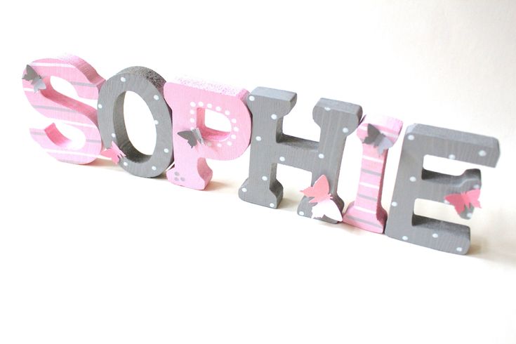 the word hope is made out of wooden letters with butterflies on them and pink, gray and white stripes