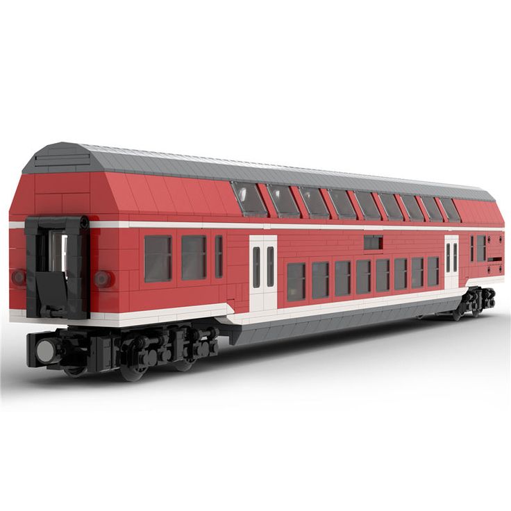 a red and white train car sitting on the tracks