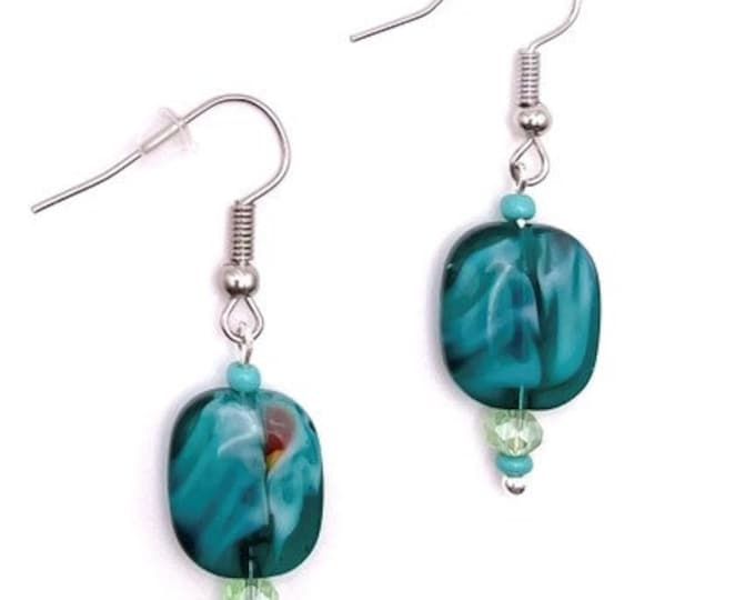 the earrings are made with glass beads