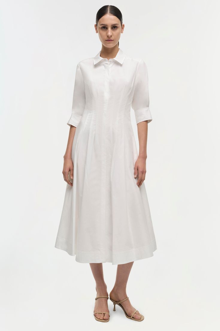 SIGNATURE COLLECTION The Signature Jazz Midi Dress in White. Sharp, shirting inspired designs accentuate a pintucked waist, cuffed sleeves and a classic midi length hemline. Dress Fit: True to size. We recommend sizing up for individuals with a fuller bust.