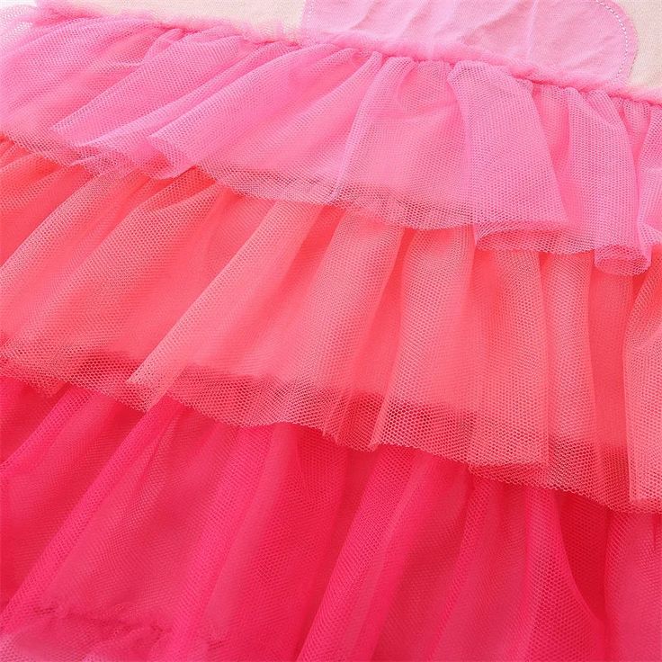 Such a cute little dress for a playdate or birthday party! Flutter sleeve cotton blend twirl dress with gorgeous pink tulle layers on the skirt and adorable pink famingo embroidered applique across the top. Perfect for every day, play dates, school, events, parties, holidays, and birthdays. Available in sizes 2T-7Y. Good things take time. Quicker shipping: this cute little dress ships directly from our overseas warehouse and will arrive to you in about 7-12 business days. Pink Tiered Ruffle Dress With Layered Hem, Cute Pink Tiered Skirt Dress, Pink Cotton Dress With Ruffled Skirt, Playful Ruffled Tutu Dress In Tulle, Playful Tulle Tutu Dress For Summer, Playful Ruffled Tulle Tutu Dress, Playful Ruffled Tutu Dress, Summer Pink Tulle Tutu Dress, Playful Ruffled Twirl Dress For Summer