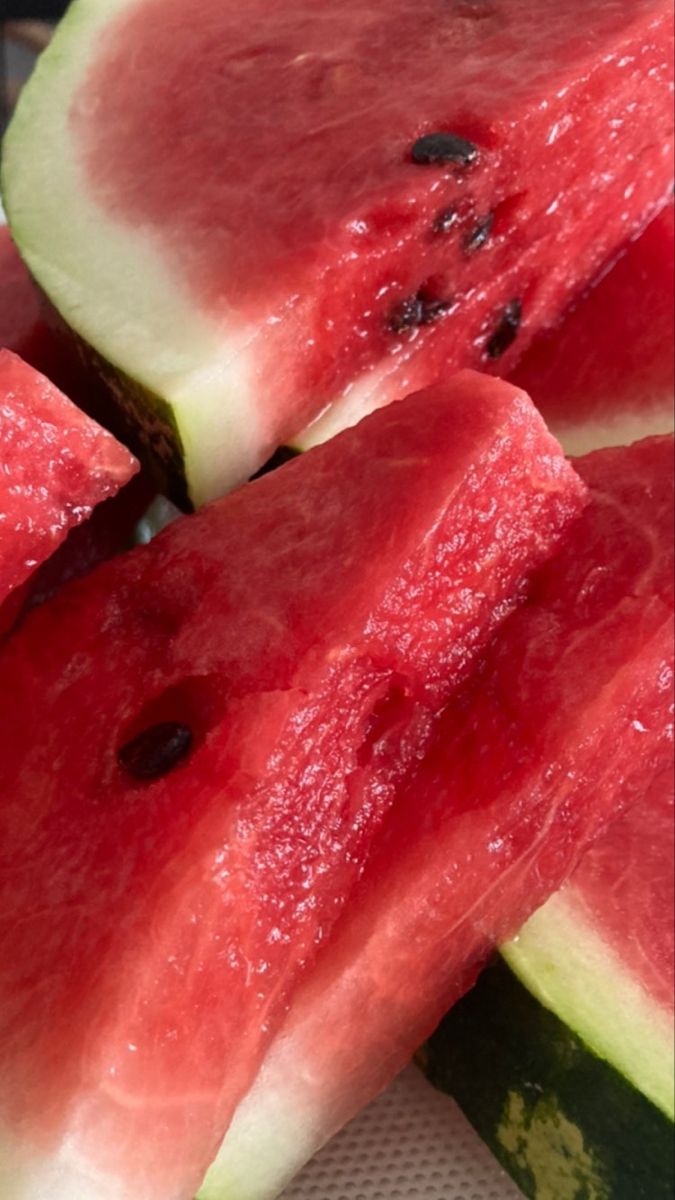 slices of watermelon sitting on top of each other