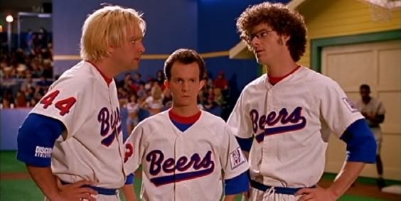 three men in baseball uniforms standing next to each other