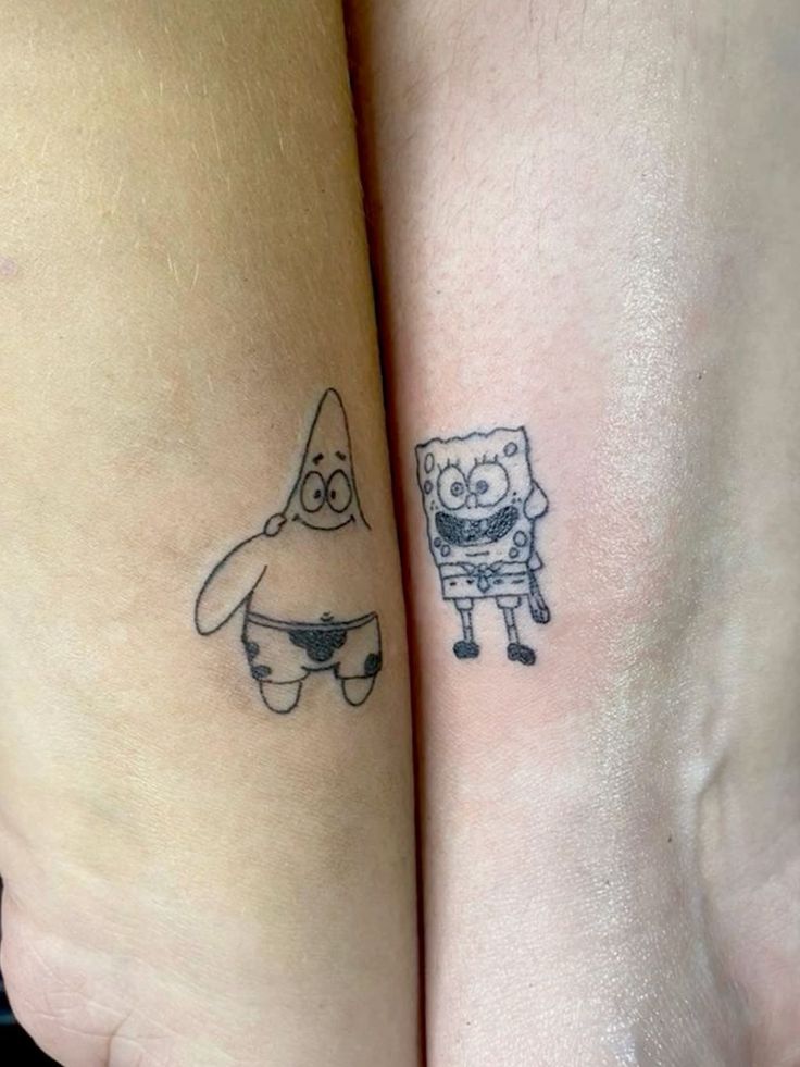 two people with matching tattoos on their legs, one has a small cartoon character and the other has a funny face