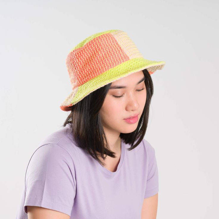 Knit bucket hat with raised contrast squiggle stripes. Made from colorful, soft hypoallergic yarn. From sunny summer beach days to cold winter walks, this bucket hat is destined for year-round wear. Each hat is one of a kind – patchwork pattern placement may vary, but that's the fun of it! Details Body: 100% Acrylic Lining: 100% Deadstock poly-cotton fabric Machine wash gentle, lay flat to reshape and dry8.5"w, 3.5"h, 2.25" brim, 22" interior circumference Casual Orange Straw Hat For Spring, Multicolor Lightweight Bucket Hat With Curved Brim, Lightweight Multicolor Bucket Hat With Curved Brim, Casual Striped Fedora Straw Hat, Casual Multicolor Fedora Sun Hat, Casual Striped Brimmed Hat, Multicolor Lightweight Bucket Hat For Spring, Striped Bucket Hat For Beach In Spring, Lightweight Multicolor Bucket Hat For Spring