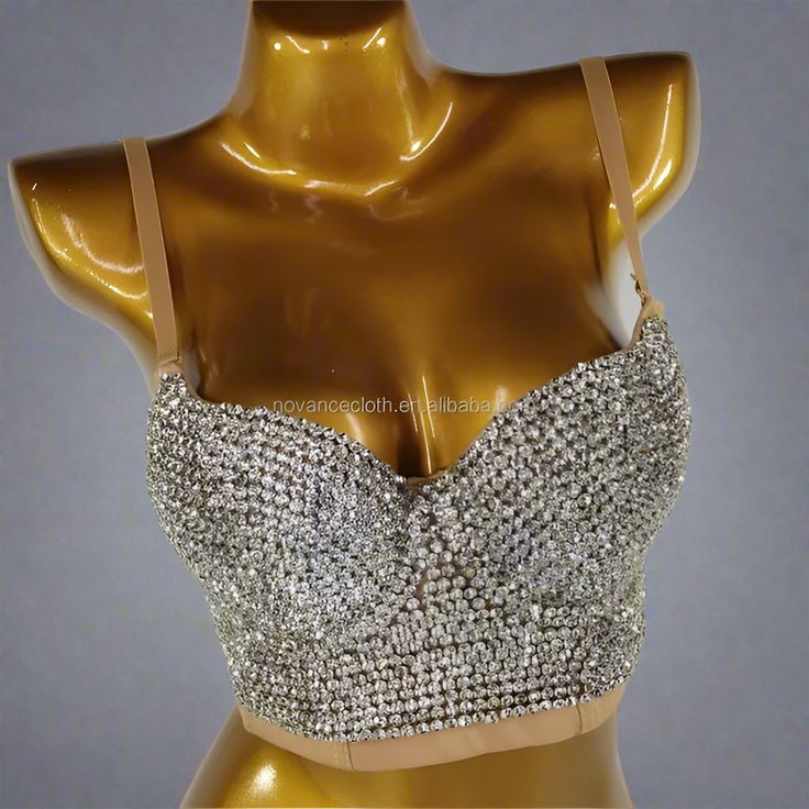 This Circle Rhinestone Chain Bra from Primadons and Donnas is a must-have for any fashionista. The bra is made with rhinestones and features a cut-out style crystal broach in the middle with adjustable chain drape sides. Silver is processed in 1 business day, while gold takes around 10 business days. This stunning piece is perfect for any special occasion or night out. With its unique design and quality craftsmanship, you'll be sure to turn heads. Get your Circle Rhinestone Chain Bra today and m Rhinestone Corset, Chain Bra, Bodysuit Tops, Corset Bra, Bodysuit Jumpsuit, Full Body Suit, Rhinestone Chain, Stocking Tights, Sweater Collection