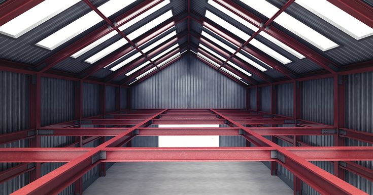 the inside of a building with red beams and windows on it's roof,