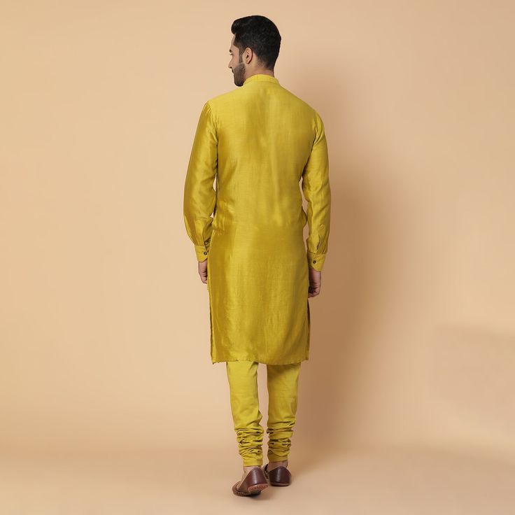 A very unique 3 paneled kurta with embroidery of an umbrella inspired from a chariot. Same color cotton lycra churidar Fabric- cotton chanderi, raw silk. Yellow is a bright and playful color, this outfit is perfect for a groom or as a brother of the bride or groom. Can be worn for Sangeet or Mehandi for a day or night event. Delivery: 20 Days Slub Silk Straight Kurta Sherwani For Festivals, Diwali Straight Kurta Sherwani In Slub Silk, Fitted Yellow Cotton Silk Kurta, Transitional Designer Cotton Silk Churidar, Yellow Chanderi Sherwani Straight Kurta, Navratri Chanderi Sherwani With Straight Kurta, Cotton Silk Bandhgala For Designer Wear, Transitional Silk Straight Kurta, Yellow Long Sleeve Raw Silk Kurta