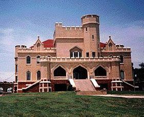 an old castle like building with stairs leading up to it